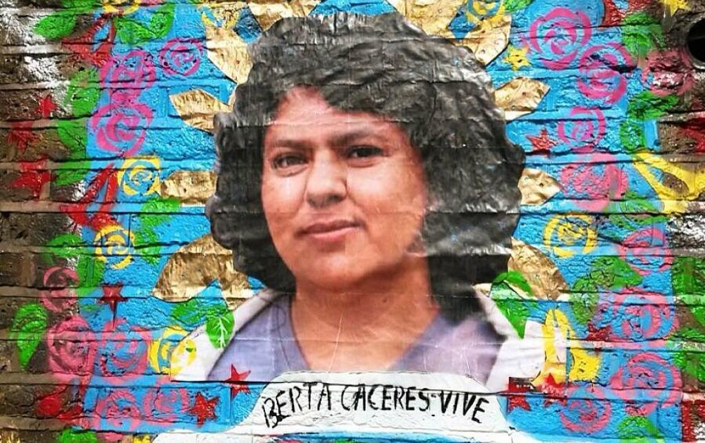 A mural of Berta Caceres, with the words "Berta Caceres Vive" underneath. Photo: Wretched of the Earth