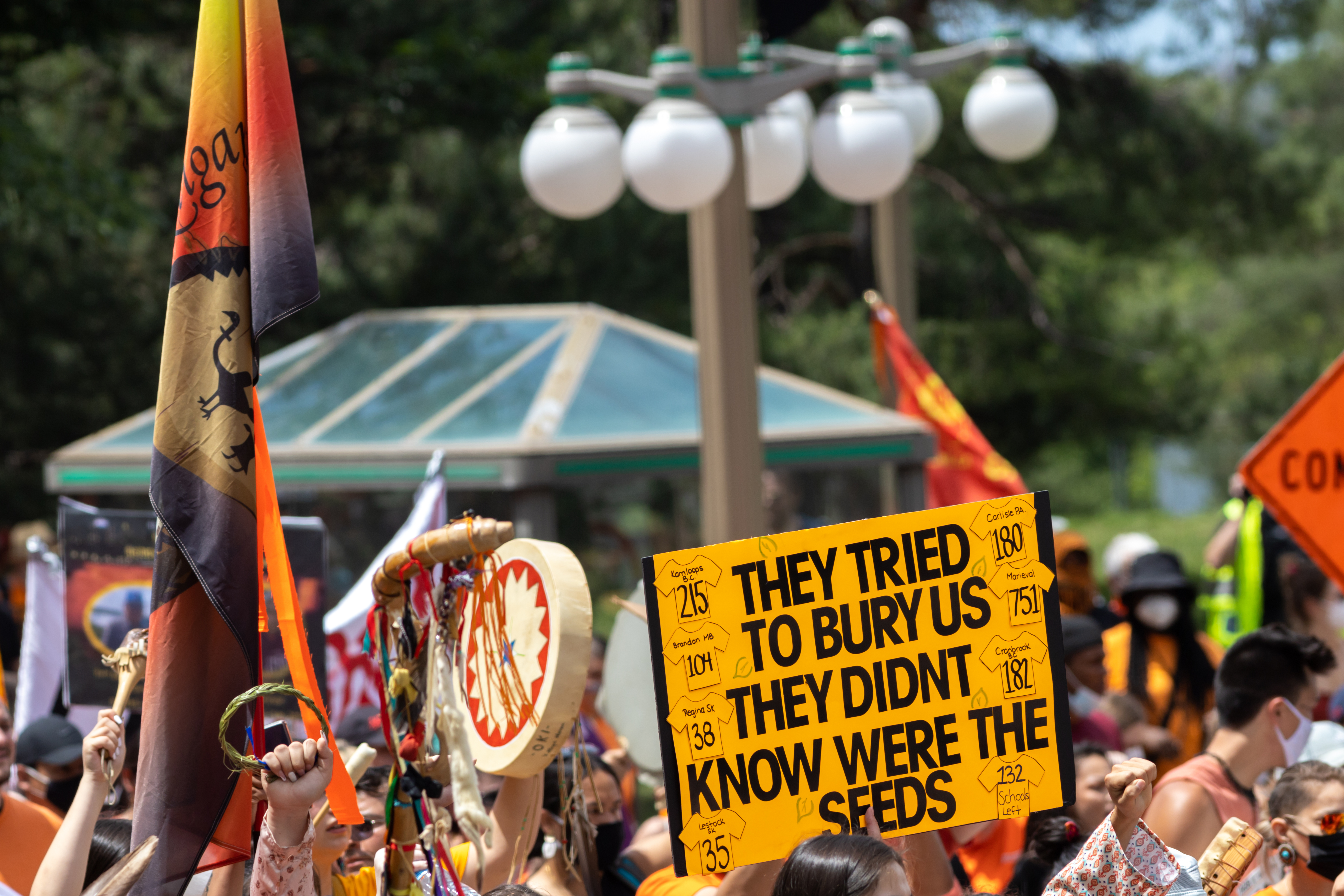 A sign held up at a Canada Day protest against the ill treatment of indigenous people by the Canadian state reads: "They tried to bury us. They didn't know we’re seeds.”   Ontario, Canada, April 2021.
