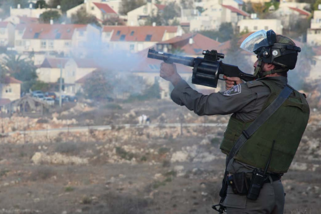 An Israeli soldier fires a grenade from a launcher. Credit: War on Want / Rich Wiles