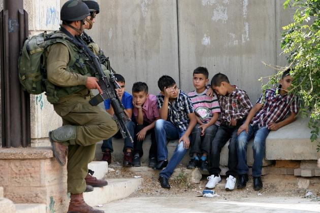 Israeli soldiers and Palestinian children