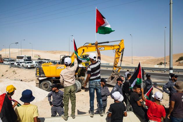 Palestinian children protest forced displacement with JCB complicity