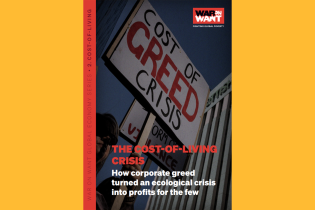 Report front page which shows a person holding a sign at a protest.