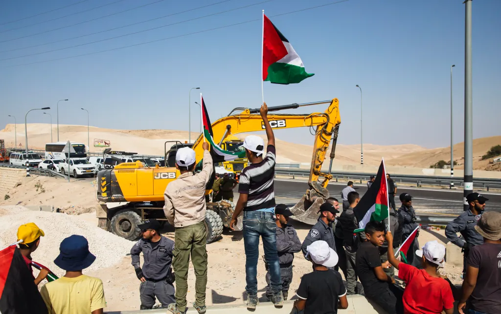 Palestinian children protest forced displacement with JCB complicity