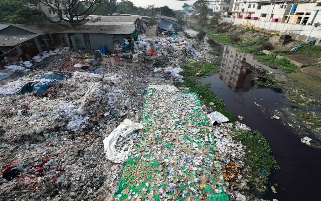 Waste material from a garments factory dumped in a canal causing it to become almost ecologically dead at Savar in Dhaka, Bangladesh, December 2017.