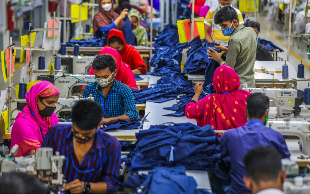 Garments workers at work in a factory during Covid19 pandemic in Gazipur, Bangladesh, May 2021.
