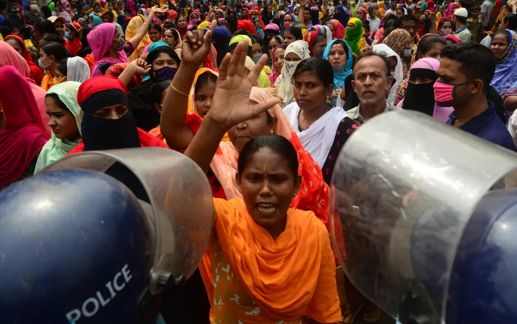 Garments workers stage a roadblock demonstration demanding their unpaid wages in Dhaka, Bangladesh, March 2021
