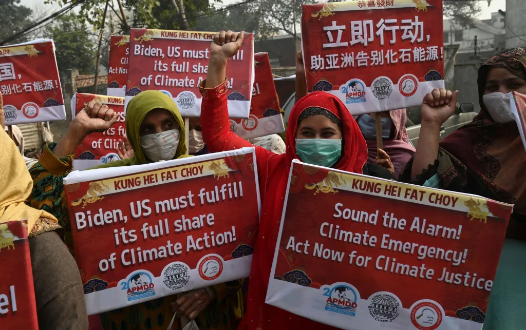 Kissan Rabita Committee (PKRC) farmers organisation, hold placards during a protest demanding action for climate justice in Lahore, Pakistan, February 2021.