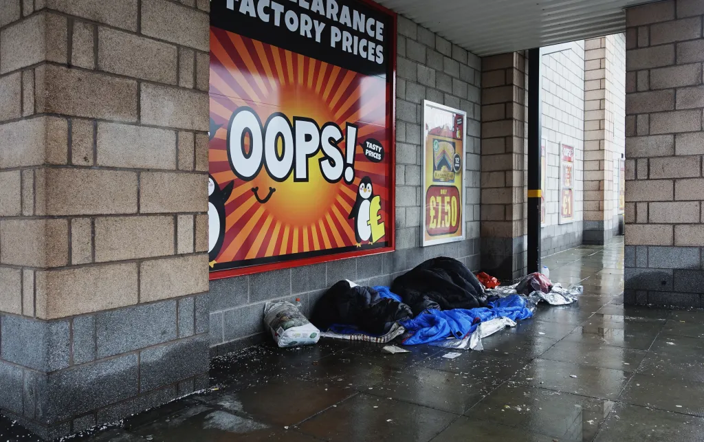 Photo of a person sleeping in the streets in the UK.