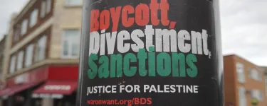 'Boycott, Divestment, Sanctions' sticker on a lamp post. Credit: Turbulent London