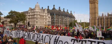 Thousands take to the streets against CETA and TTIP across Europe. Protestors hold a huge banner that reads "Hands off democracy #noTTIP". Photo: Global Justice Now