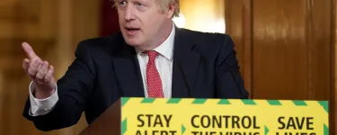Prime Minister Boris Johnson holds the Daily Covid-19 Digital Press Conference, gesturing and standing in front of a lectern with the government slogan on the front: "Stay alert > Control the virus > Save lives". Photo: Pippa Fowles / No 10 Downing Street.