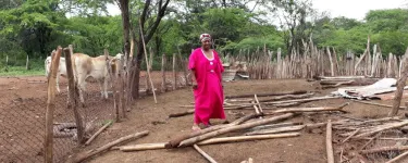 Eneida, standing in what's left of of her home, after it was destroyed by Cerrejon in September, 2017