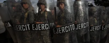 A row of Honduran military holding riot shields during 2017 elections. Photo: Sean Hawkey