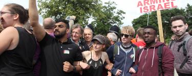 Protesters with a "UK Stop Arming Israel" sign. Credit: Rich Wiles.