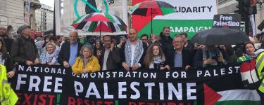 A crowd at a rally behind a batter that reads: "National Demonstration for Palestine. Free Palestine. Exist! Resist! Return!" Credit: Palestine Solidarity Campaign.