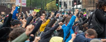 Anti racism hands raised protest