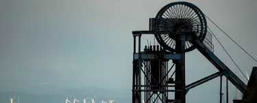Black machinery, windfarm in background