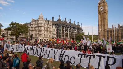 Thousands take to the streets against CETA and TTIP across Europe. Protestors hold a huge banner that reads "Hands off democracy #noTTIP". Photo: Global Justice Now