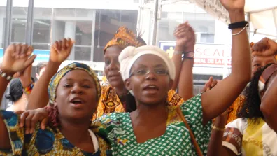 Francia Marquez and other Black women raise fists in the air.