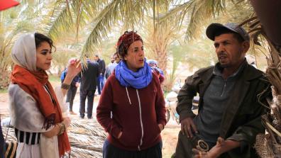 Activists from Algeria and Morocco talking with one of the agricultural workers in the oasis of Jemna in southern Tunisia about their experience since 2011 and the challenges they are still facing. This was part of an international solidarity caravan to southern Tunisia supported by War on Want in the spring of 2017. Photo Credit: Nadir Bouhmouch