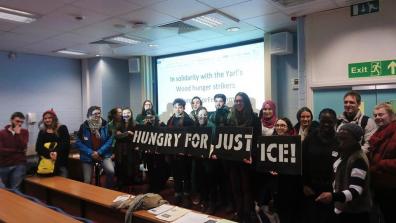 Students at a King's College London event hold a banner that reads "Hungry for justice". Credit: KCL Action Palestine.