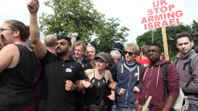 Protesters with a "UK Stop Arming Israel" sign. Credit: Rich Wiles.