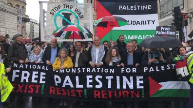 A crowd at a rally behind a batter that reads: "National Demonstration for Palestine. Free Palestine. Exist! Resist! Return!" Credit: Palestine Solidarity Campaign.