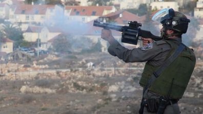 An Israeli soldier fires a grenade from a launcher. Credit: War on Want / Rich Wiles