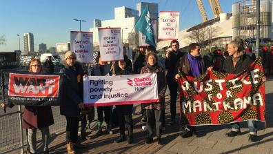 Campaigners at the UK– Africa Investment Summit in London 2020 with placards including "Say no to Empire 2.0", "Stop the new scramble for Africa", and "Justice for Marikana". 