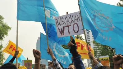 Jakarta, Indonesia. 6th Dec, 2013. Indonesian workers hold placards during a protest against trade liberalization, deregulation and privatization on the final day of the World Trade Organization (WTO) 9th Ministerial Conference outside the U.S. Embassy in Jakarta, Indonesia, Dec. 6, 2013. Credit: Agung Kuncahya B./Xinhua/Alamy Live News